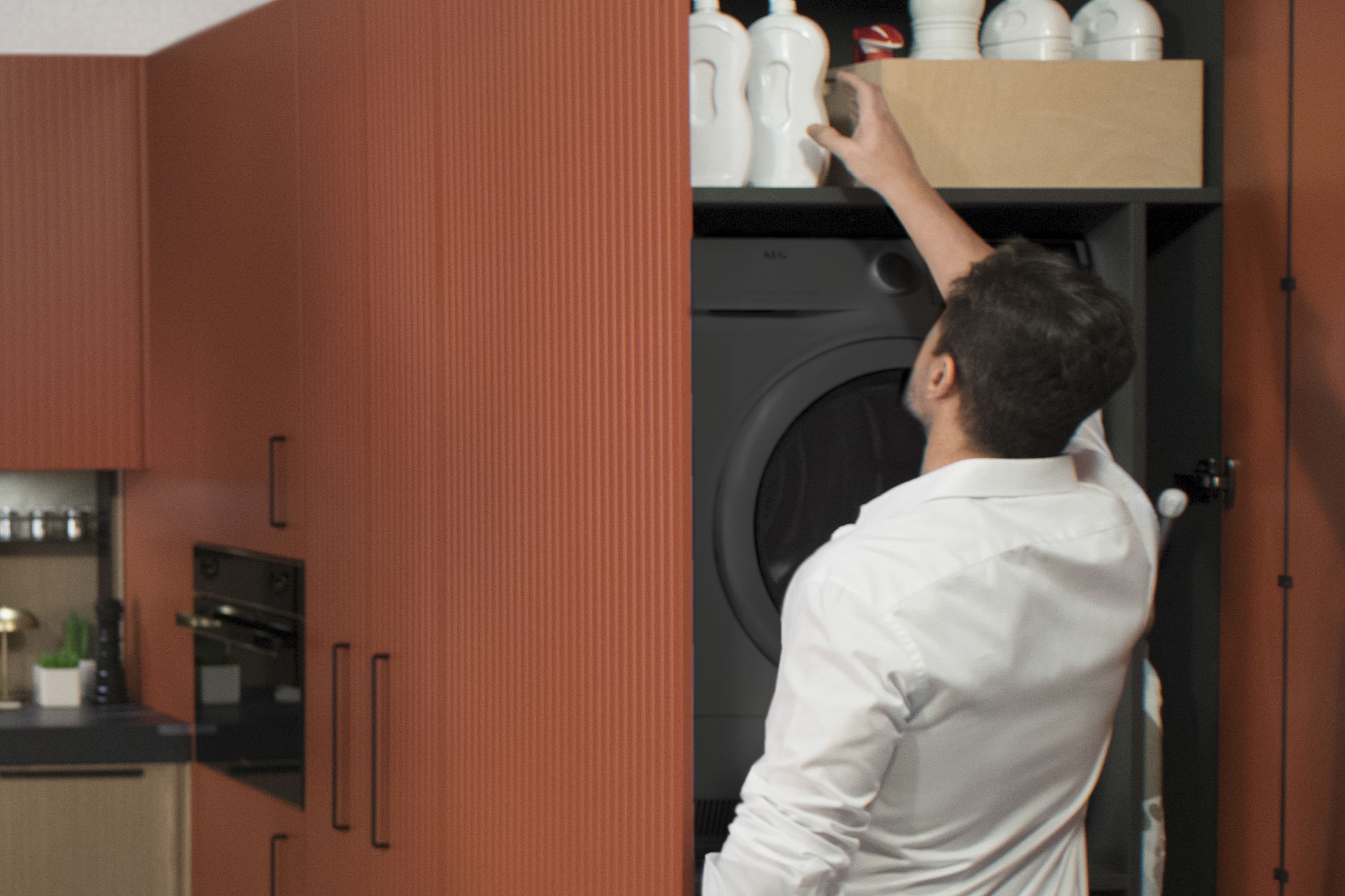 Armario alto que oculta lavadora y secadora, integrando funcionalidad de lavandería en la cocina. Espacio superior aprovechado con estantes para almacenaje adicional. Diseño limpio y eficiente.